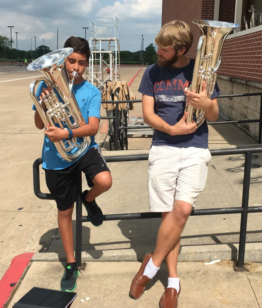 Jeff Homick alongside his student Miguel, both holding euphoniums