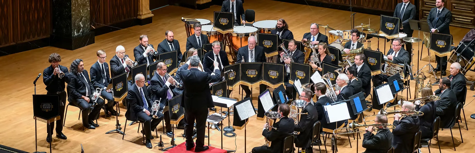 Houston Brass Band performing on a concert hall stage